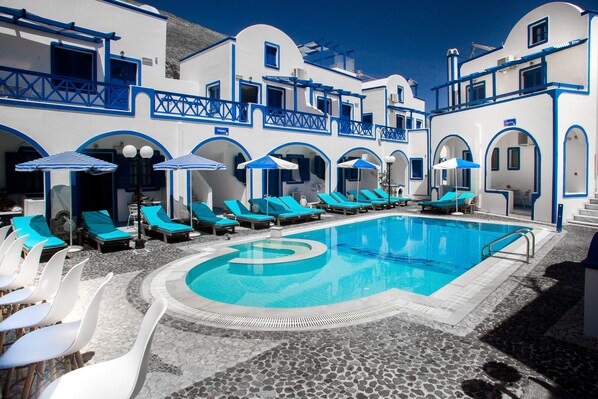 Outdoor pool, pool umbrellas, pool loungers