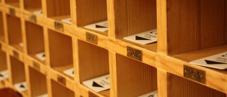A close-up of a wooden shelving unit with numbered compartments, likely used for storage or organization.