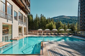 Indoor pool, outdoor pool, pool umbrellas, pool loungers