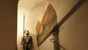 A staircase with a statue at the top. - B & Beatrice (Florence)
