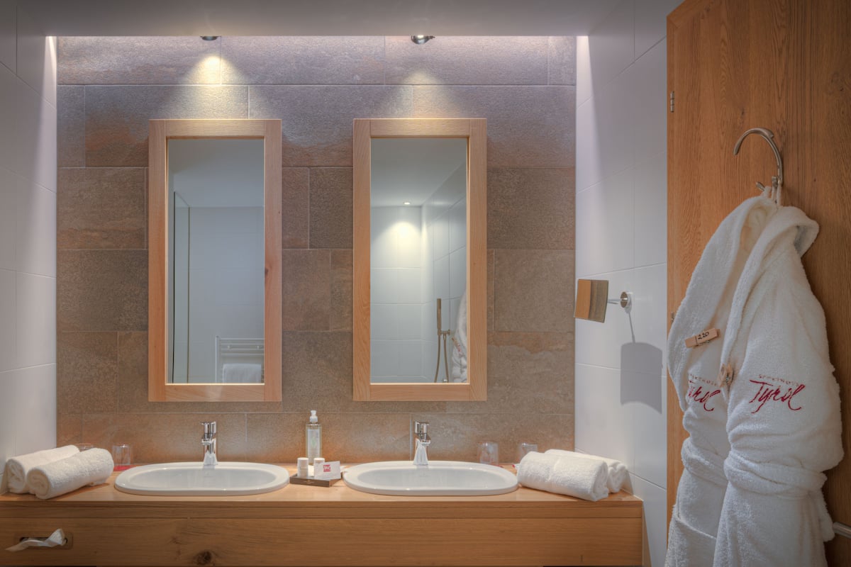 family suite | bathroom | shower, free toiletries, hair dryer, bathrobes