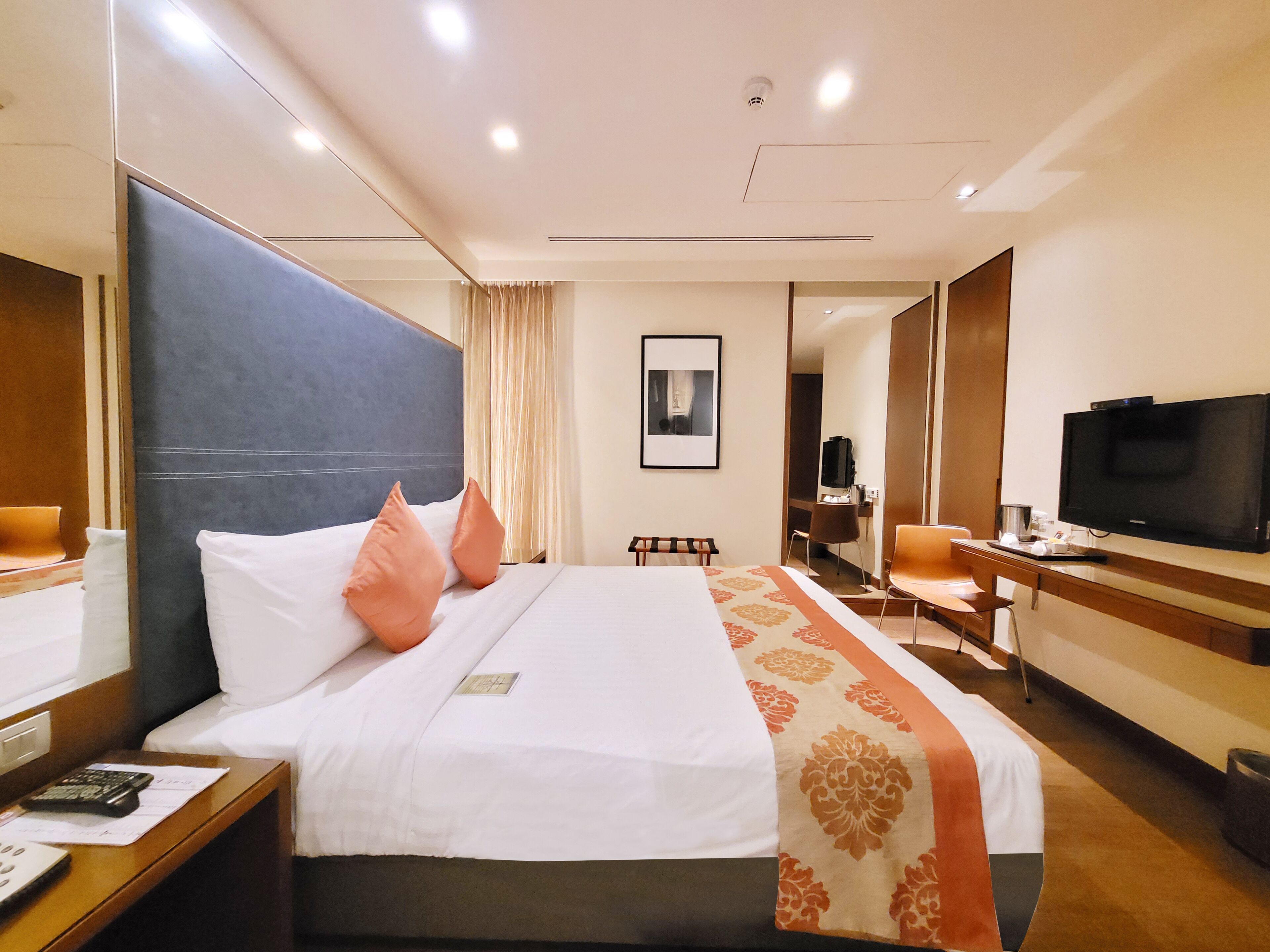 amber deluxe room | premium bedding, minibar, in-room safe, desk