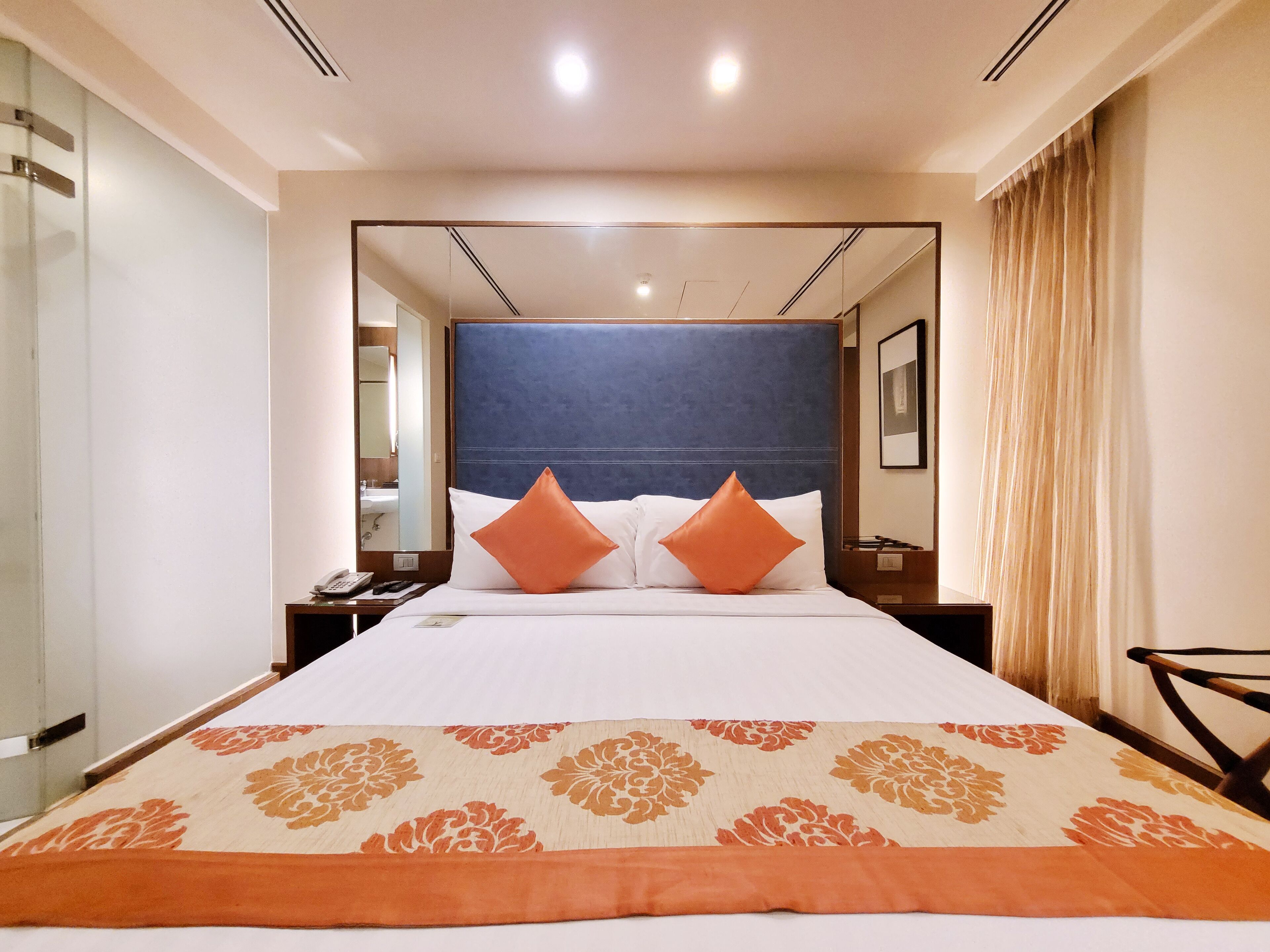 amber deluxe room | premium bedding, minibar, in-room safe, desk