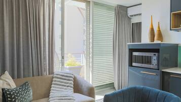 Junior-Penthouse | Wohnbereich | Flachbildfernseher