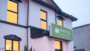 A two-story hotel with a sign reading "Maple Hotel". - The Maple Hotel (Liverpool)