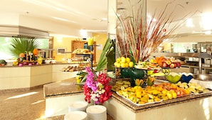 A buffet with a variety of fruits and vegetables, including apples, oranges, and bananas. - Hotel LIVVO Costa Taurito & Aquapark - All Inclusive (Mogan)