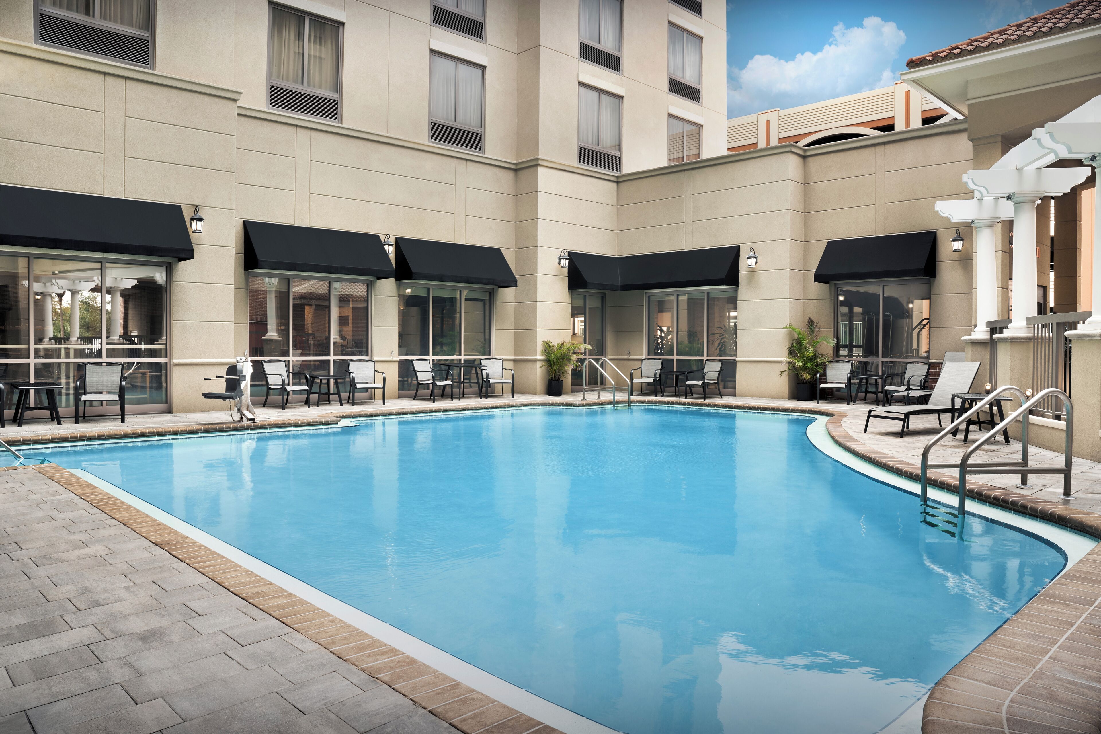 outdoor pool, open 10:00 am to 10 pm, pool loungers