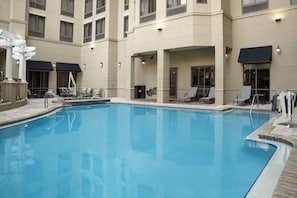 Outdoor pool, open 10:00 AM to 10 PM, pool loungers