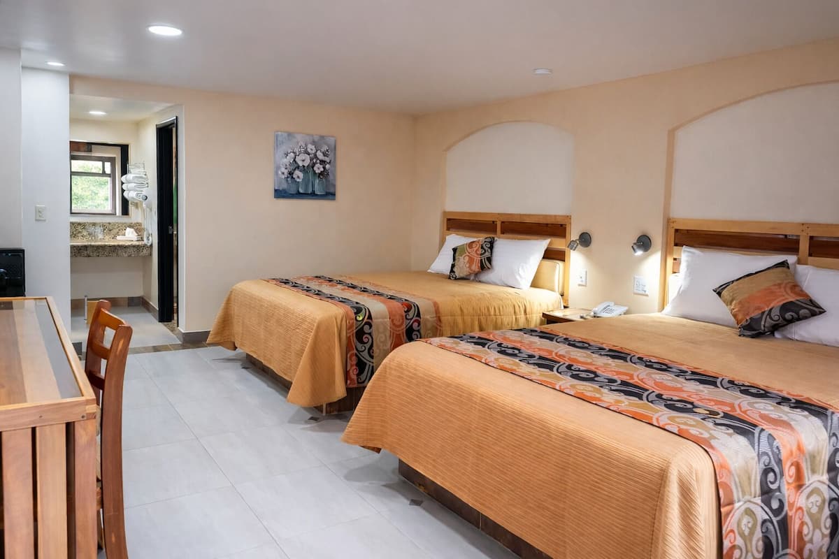 Deluxe Quadruple Room | Desk, iron/ironing board, free wired internet, bed sheets