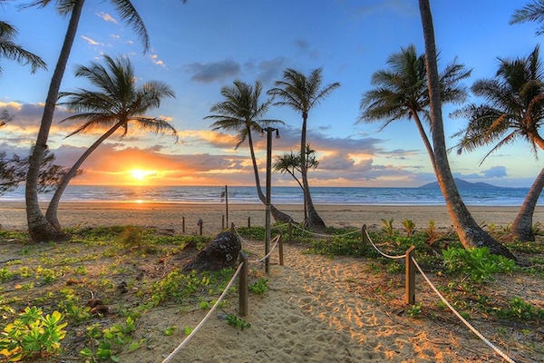 On the beach, white sand, sun-loungers, beach umbrellas