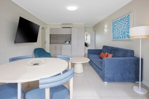 Beachfront Family Room | Premium bedding, laptop workspace, blackout curtains, iron/ironing board