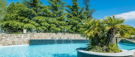 Indoor pool, pool umbrellas, pool loungers