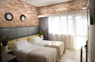 Double or Twin Room | Minibar, in-room safe, desk, blackout drapes