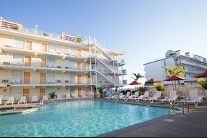 Seasonal outdoor pool, open 10 AM to 10 PM, pool umbrellas