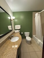 Standard Room, 1 King Bed, Non Smoking | Bathroom | Combined shower/tub, free toiletries, hair dryer, towels