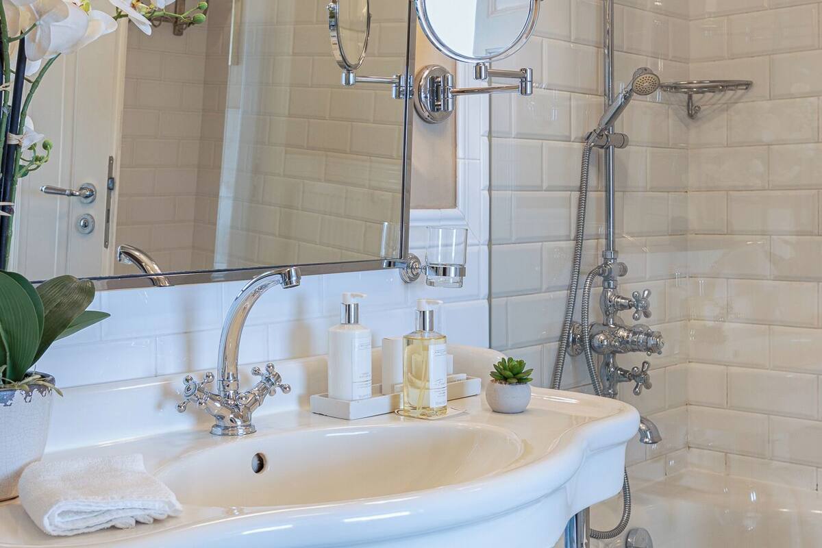 panorama suite | bathroom | rainfall showerhead, free toiletries, hair dryer, bathrobes