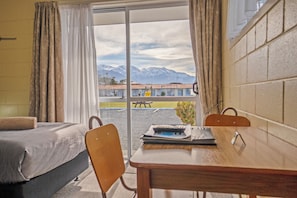 Family Studio, Multiple Beds | Living area | 32-inch LED TV with cable channels, TV
