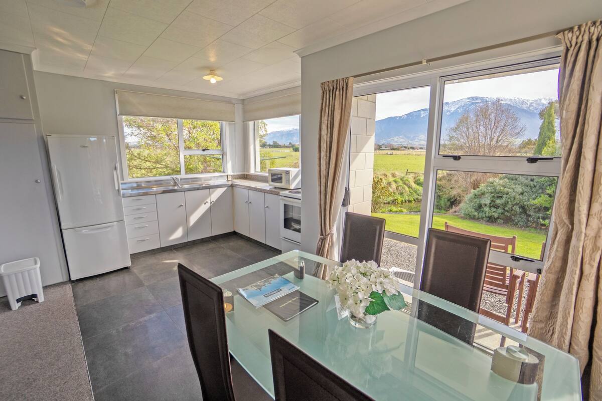 Comfort Suite, 1 King Bed, Mountain View | Living area | 32-inch LED TV with cable channels, TV