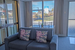 Family Apartment, 2 Bedrooms | Living area | 32-inch LED TV with cable channels, TV