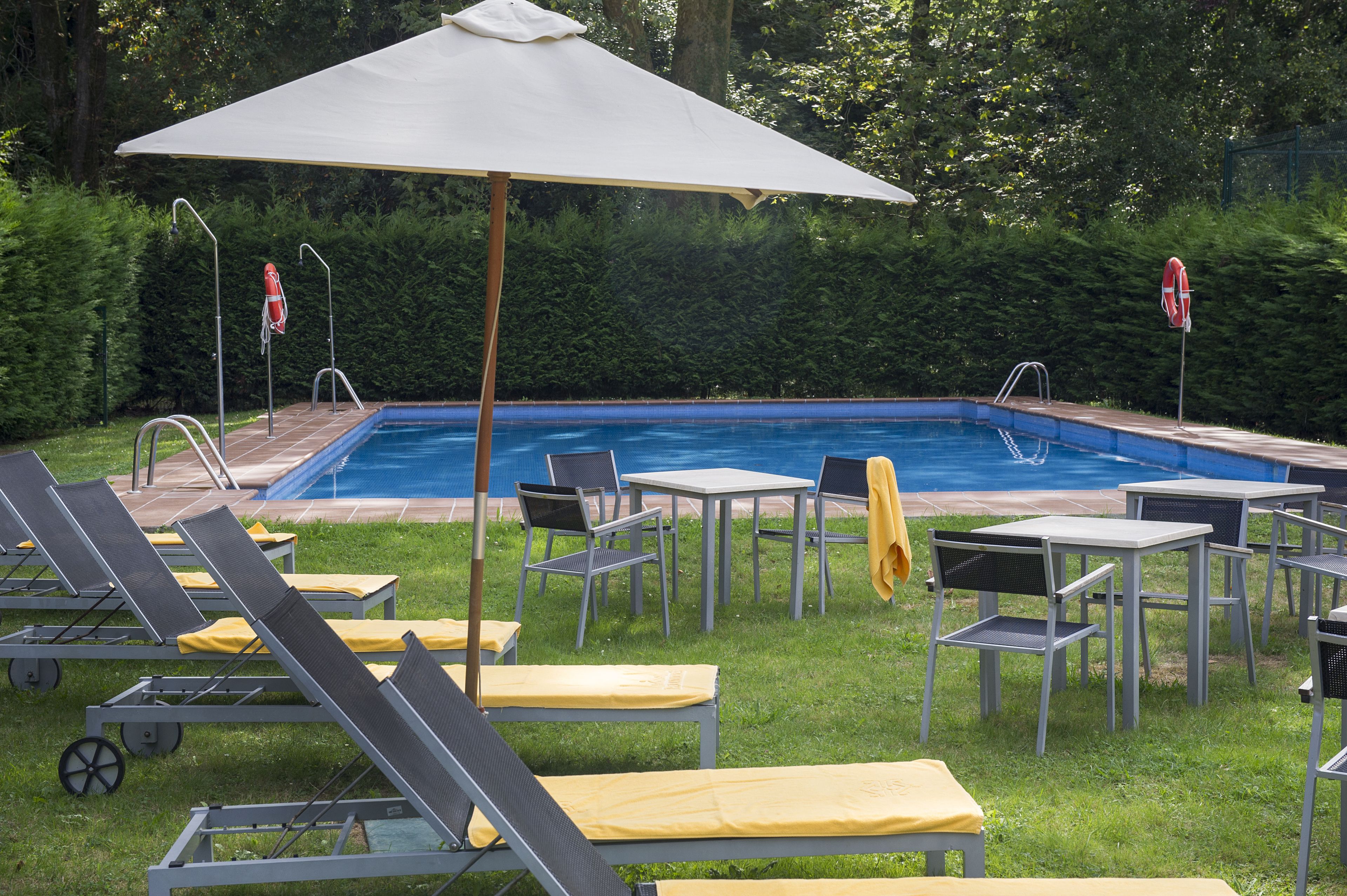 outdoor pool, pool umbrellas, pool loungers