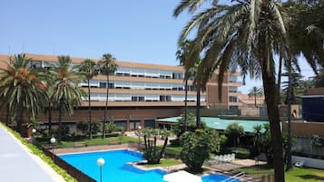 Outdoor pool, open noon to 8:00 PM, pool umbrellas, pool loungers