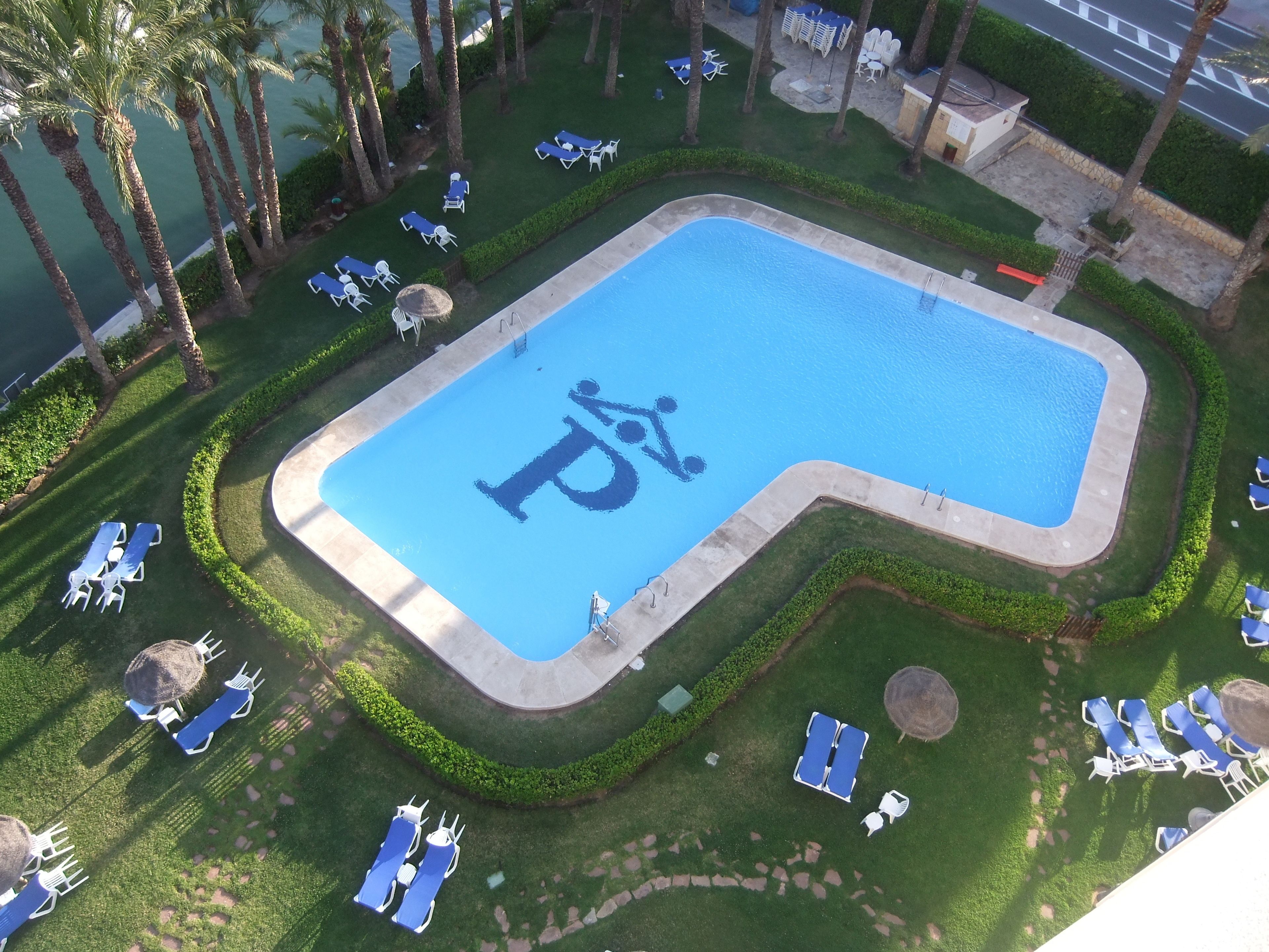 seasonal outdoor pool, pool umbrellas, pool loungers