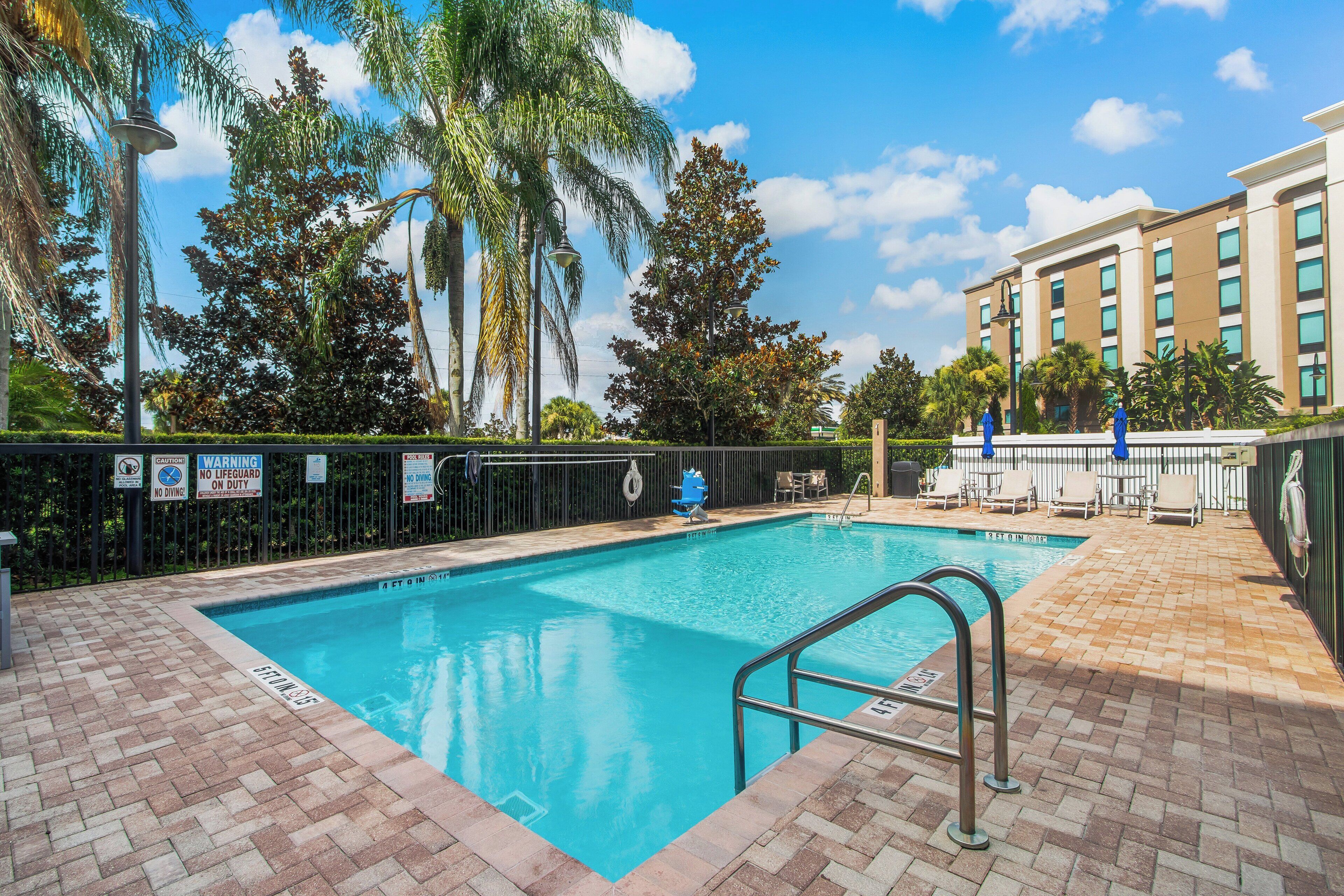 Outdoor pool, open 9 AM to 10 PM, pool loungers
