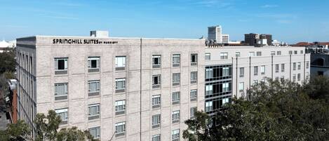 A multi-story building with the name "SPRINGHILL SUITES BY MARriott" on the facade.