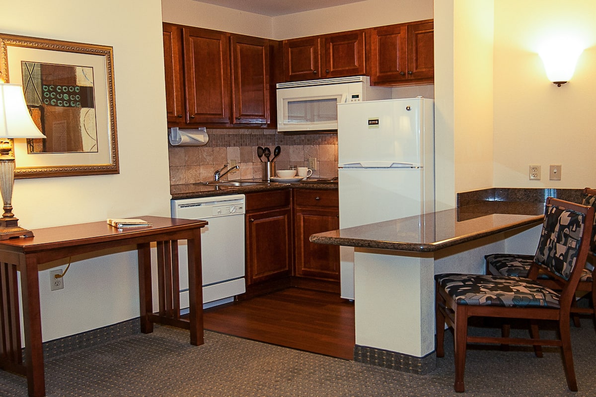 full-sized fridge, microwave, stovetop, dishwasher