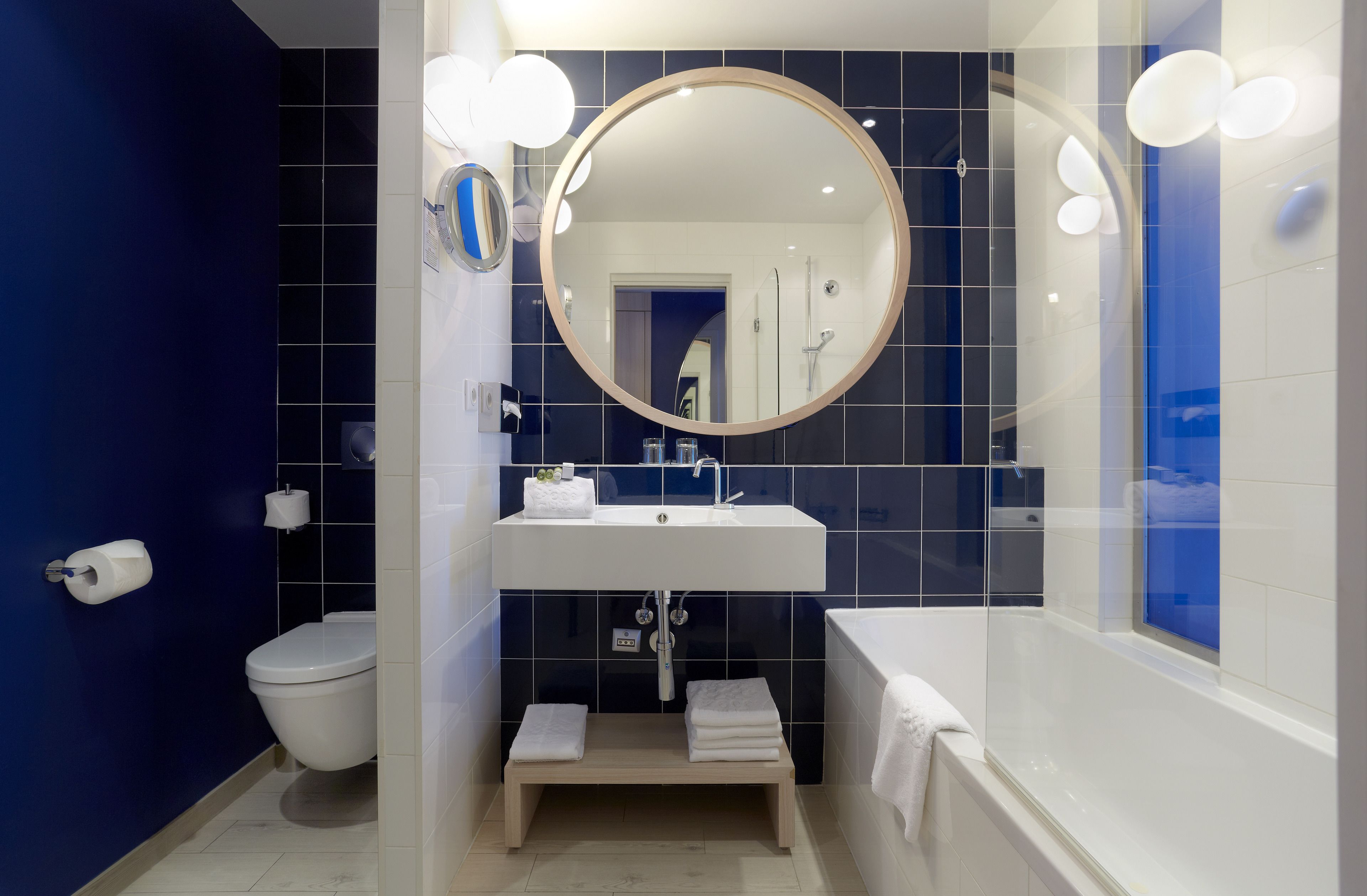 designer toiletries, hair dryer, towels