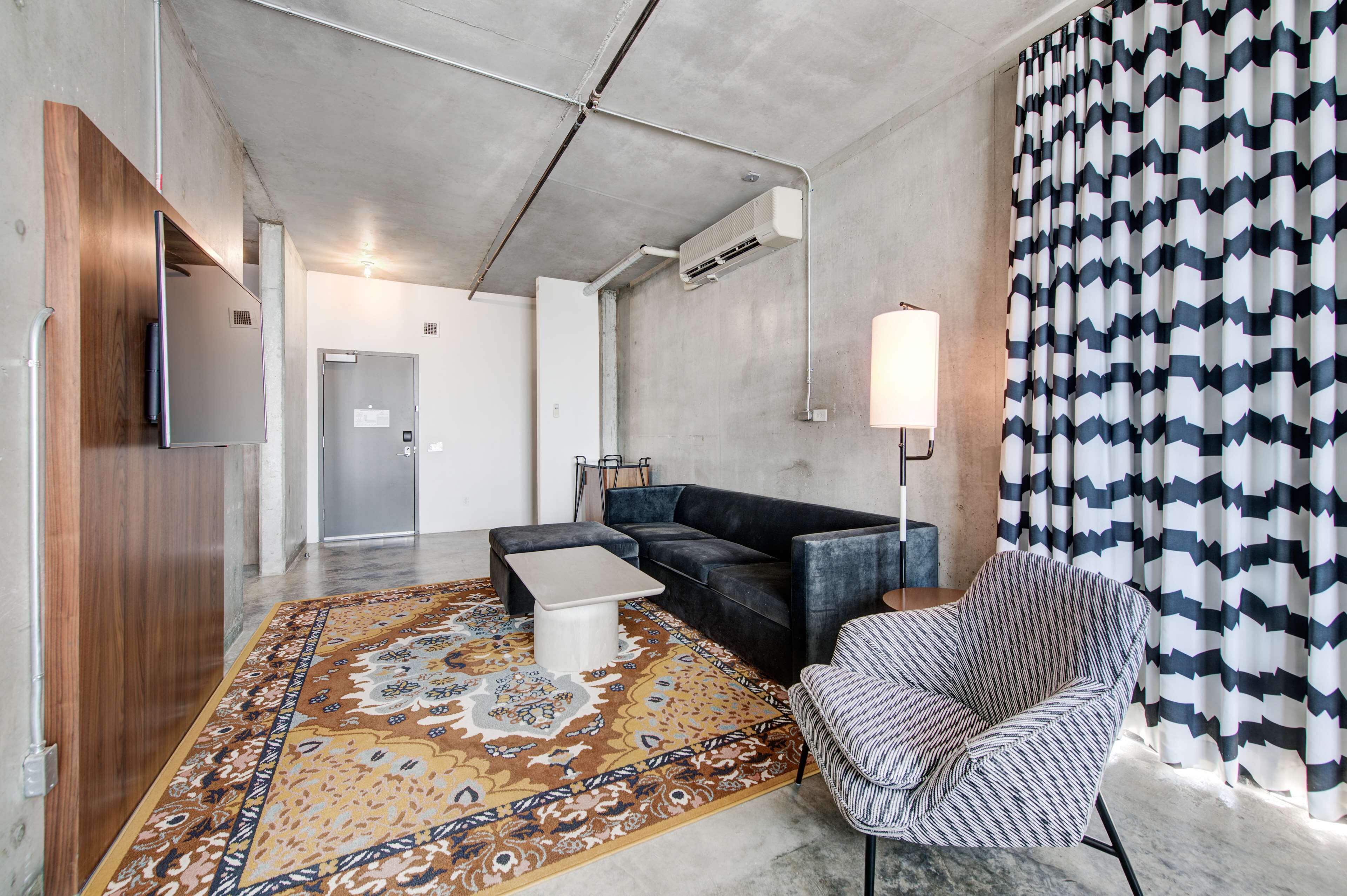 suite, 1 king bed, balcony | living area | 50-inch flat-screen tv with cable channels, tv, netflix