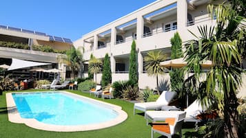 Outdoor pool, open 9 AM to 8 PM, pool umbrellas, sun loungers