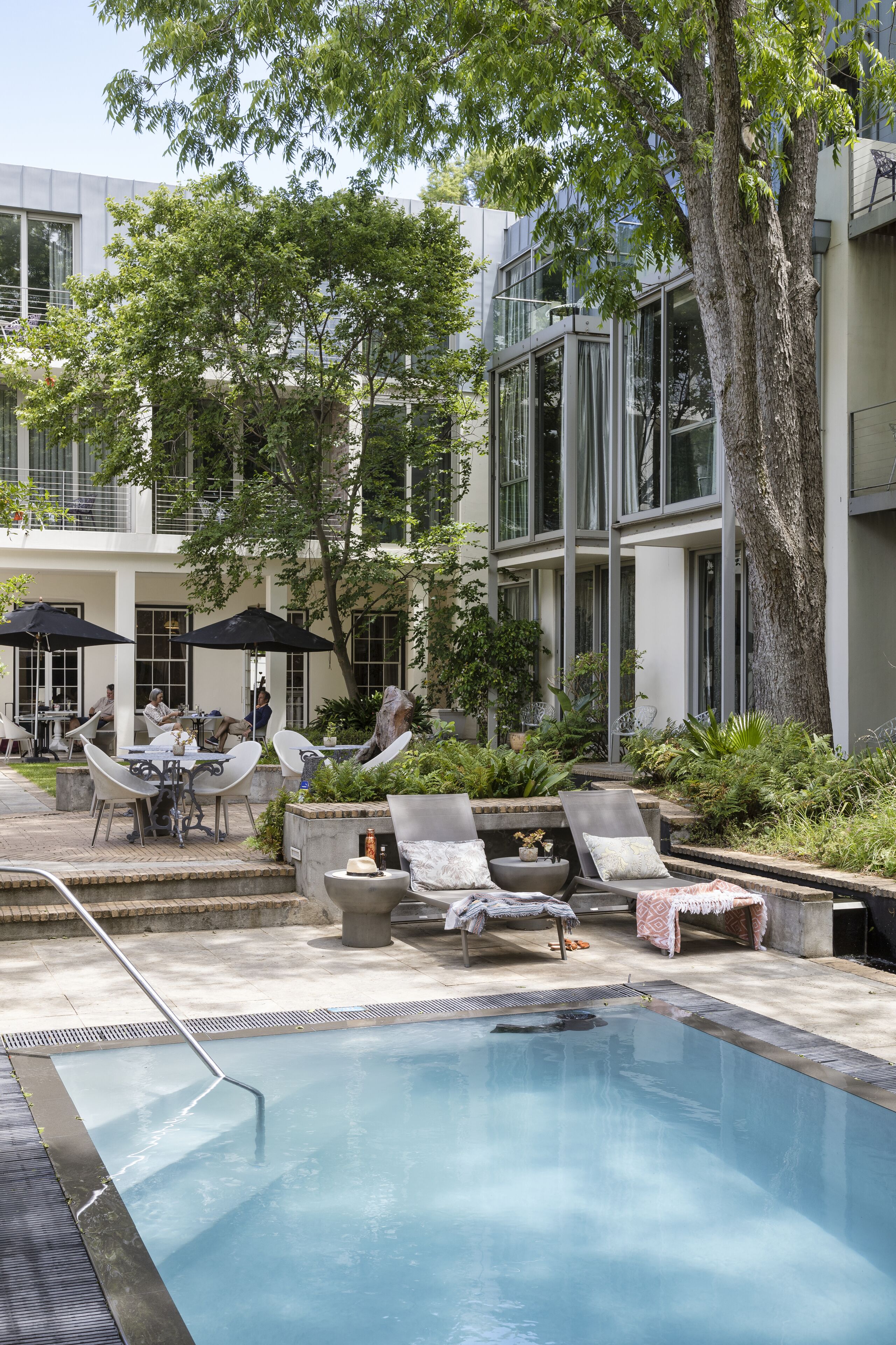 outdoor pool, pool umbrellas, pool loungers