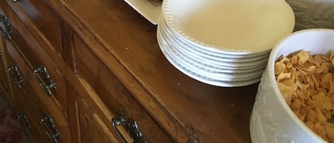 A breakfast buffet with various food items and beverages.