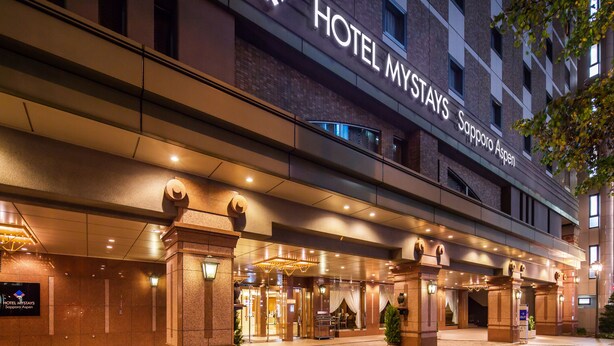 A hotel entrance with a prominent sign reading "HOTEL MYSTAYS Sapporo Aspen". - Hotel Mystays Sapporo Aspen (Sapporo)