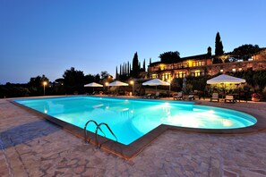 Seasonal outdoor pool, open 10:00 AM to 7:00 PM, pool umbrellas