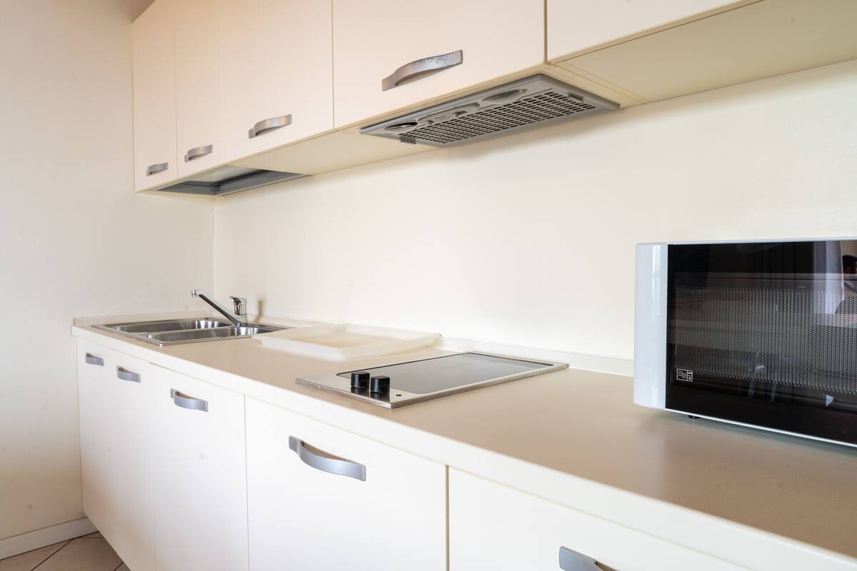 family room, 1 bedroom | private kitchen