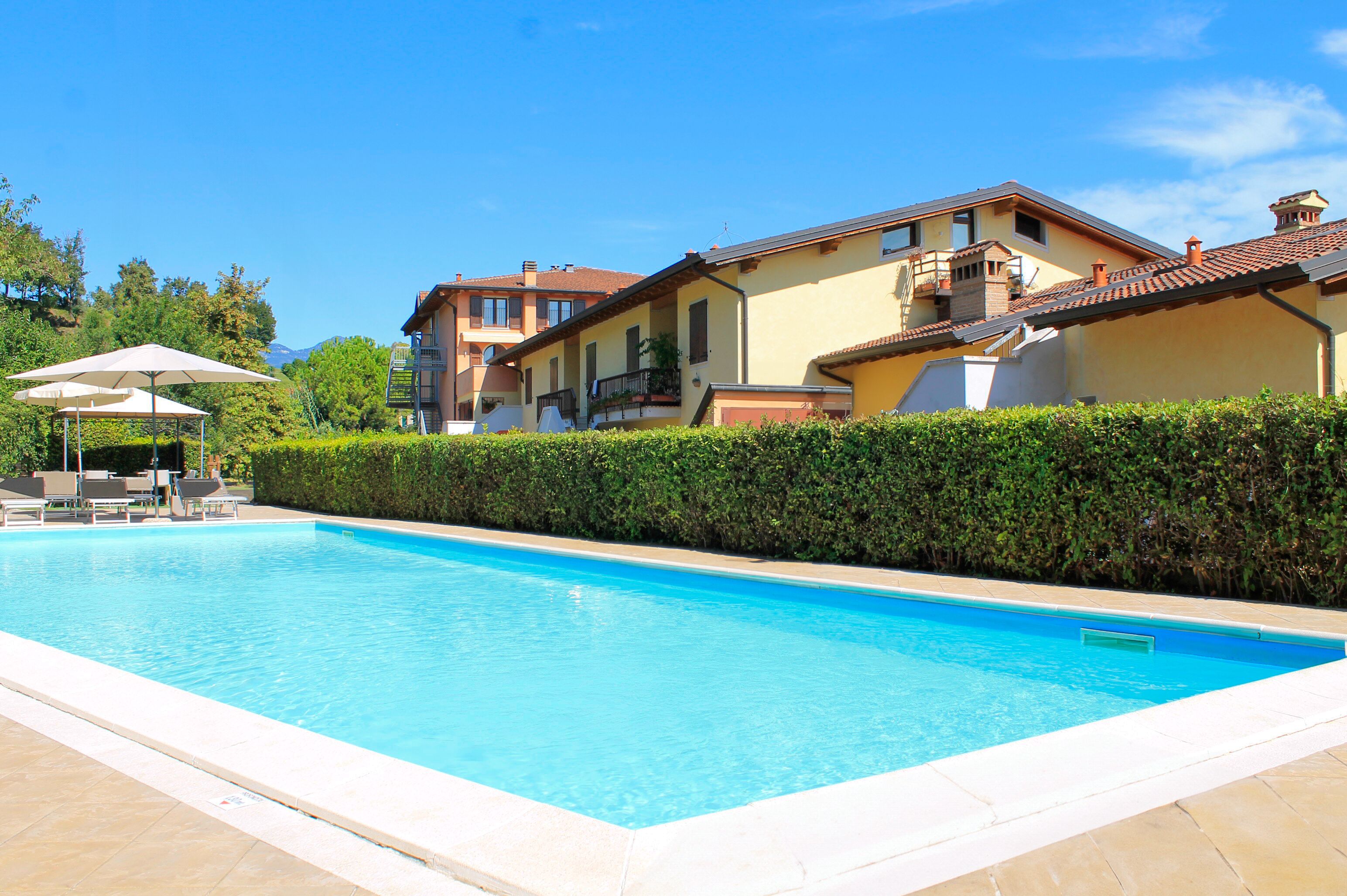 outdoor pool, pool umbrellas, pool loungers