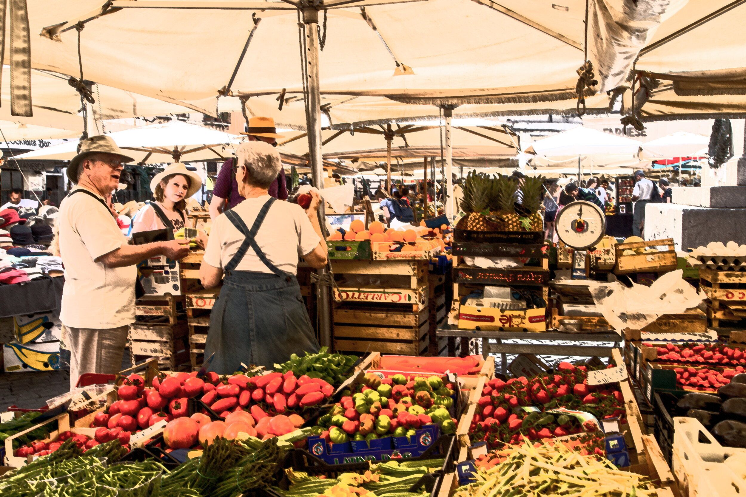 A market stall with various fruits and vegetables displayed in crates.