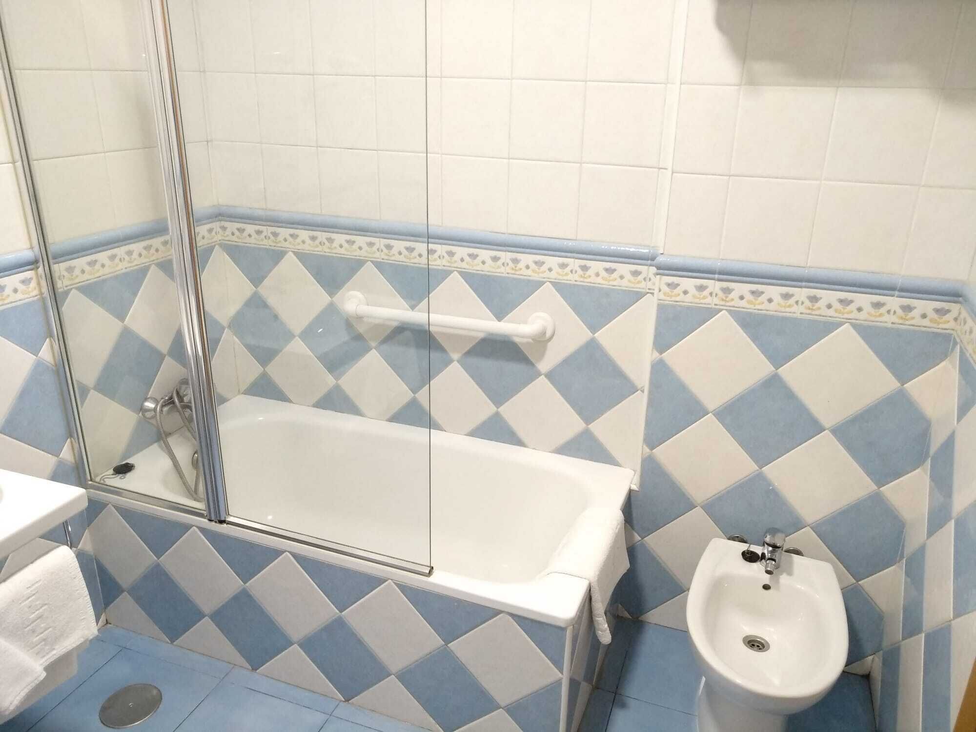 bathtub, free toiletries, hair dryer, bidet