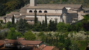 A historic building with a central tower, arched windows, and a surrounding courtyard. - Il Panciolle (Spoleto)