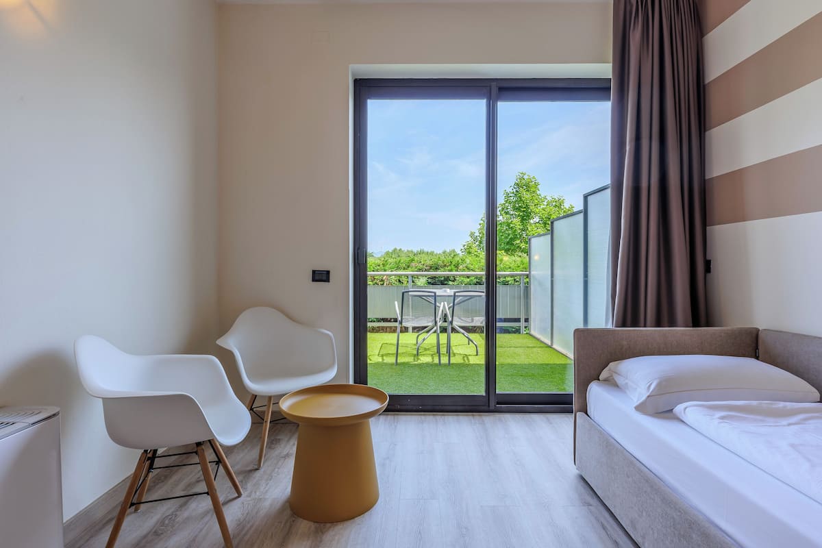 Triple Room, Balcony | Minibar, in-room safe, desk, blackout drapes