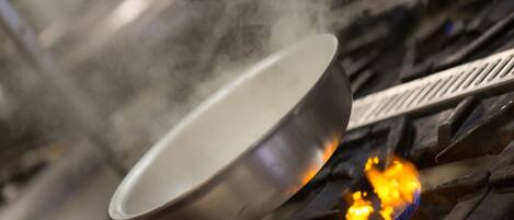 A metal pan over a fire.