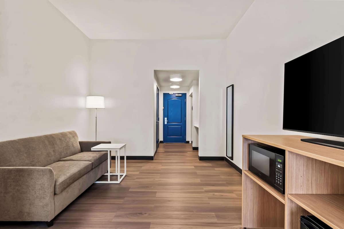 room, 1 king bed with sofa bed | premium bedding, laptop workspace, blackout curtains, iron/ironing board