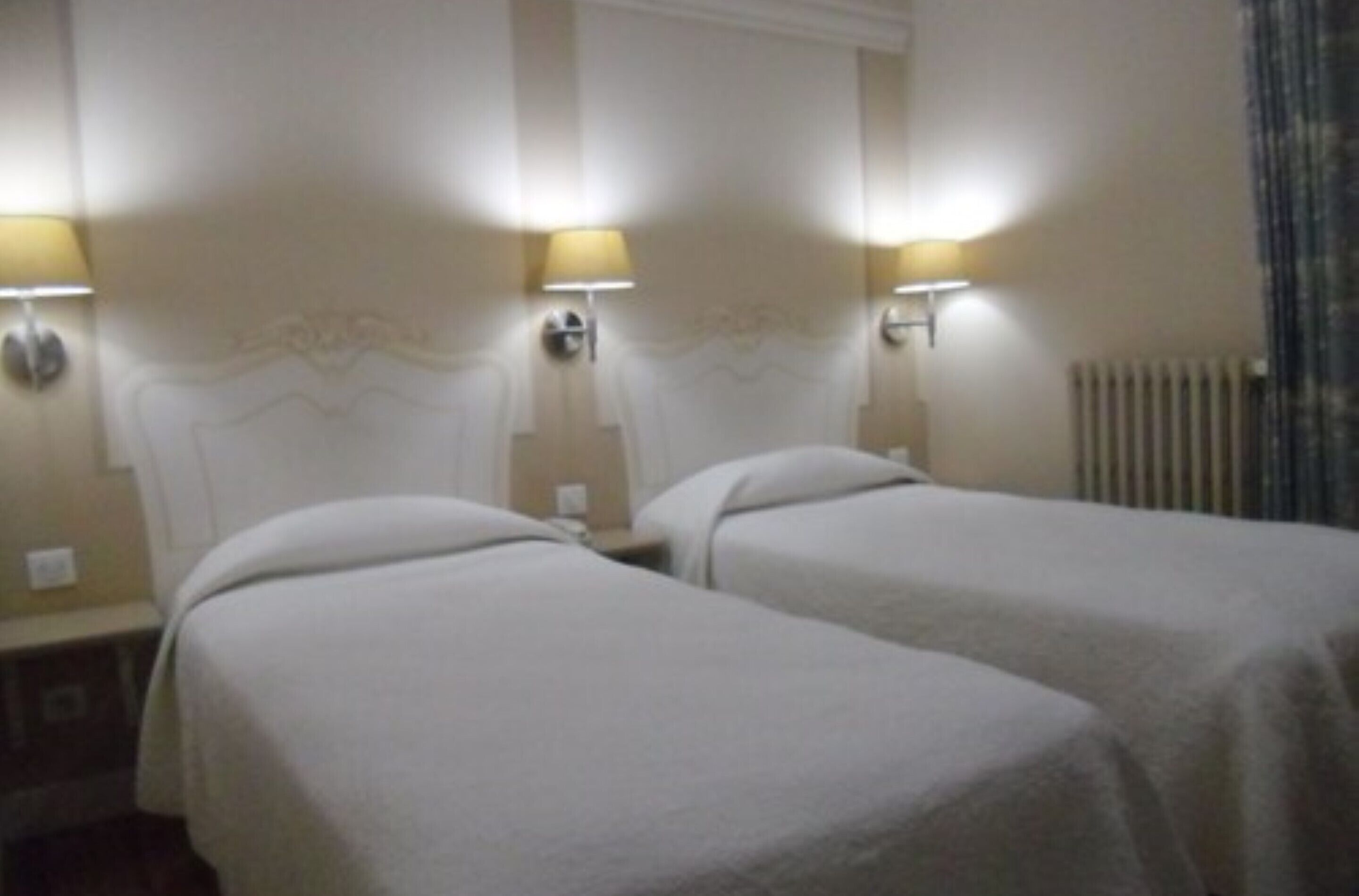 twin room | desk, blackout curtains, soundproofing, rollaway beds