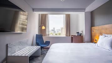 Suite Deluxe, 1 cama King size | Edredón, caja de seguridad en la habitación y escritorio