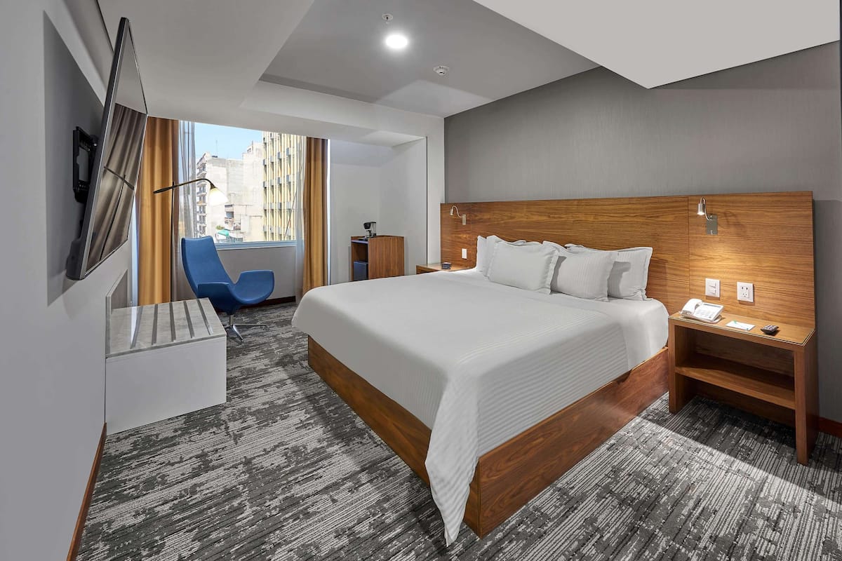 Deluxe Suite, 1 King Bed | Down duvets, in-room safe, desk, blackout curtains