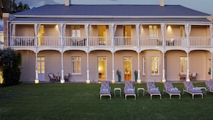 A large, two-story building with a balcony and multiple windows. - Dock House Boutique Hotel & Spa by NEWMARK (Cape Town)