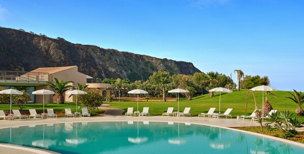 Seasonal outdoor pool, pool umbrellas, pool loungers