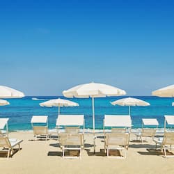 Private beach, white sand, sun loungers, beach umbrellas